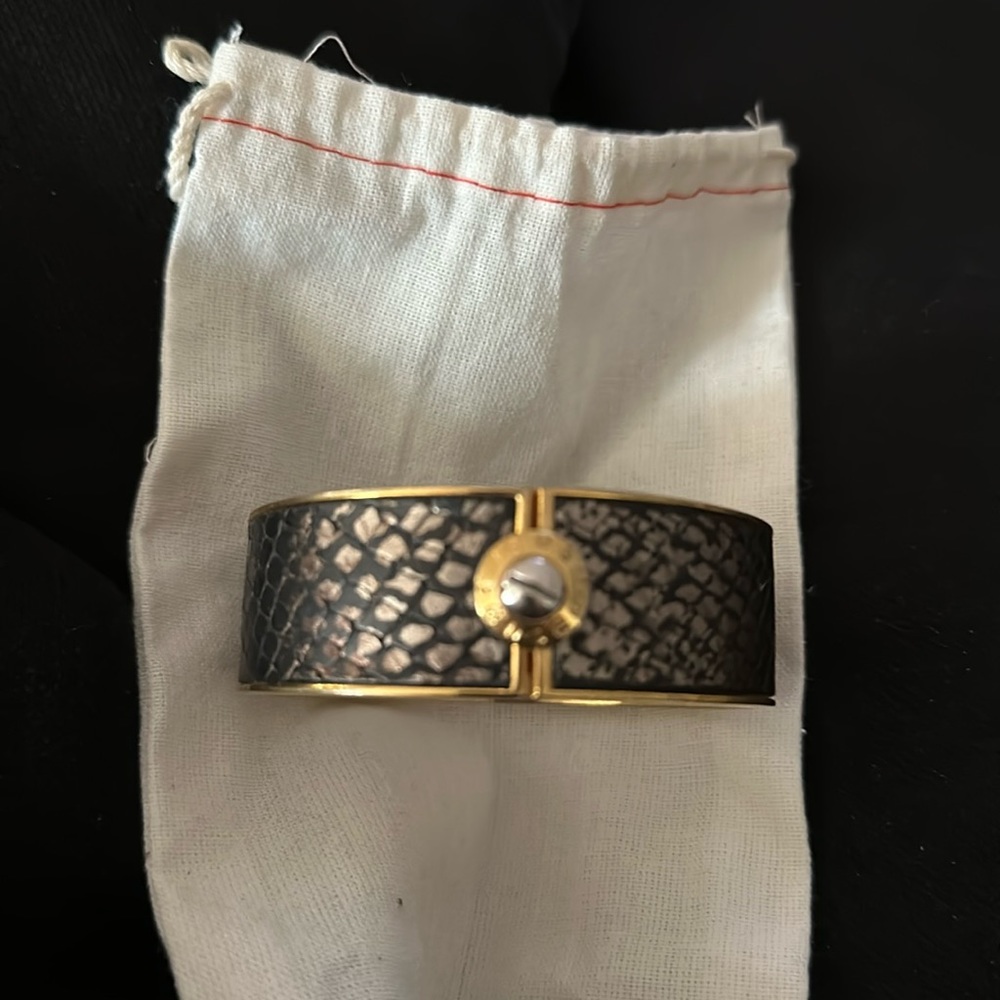 Henri Bendel hand cut snakeskin leather bangle w/gold trim and rivet enclosure